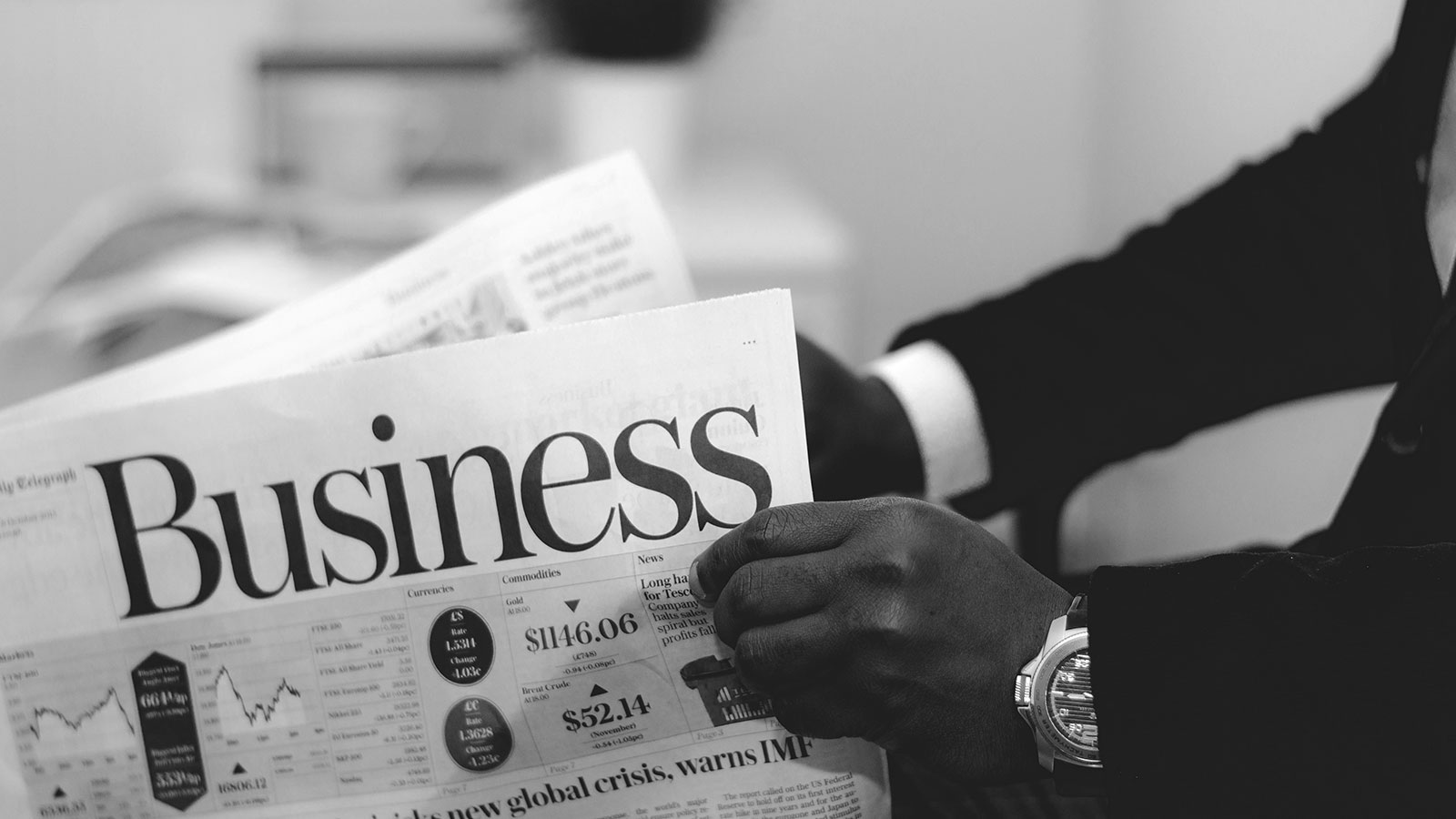 LeasePilot Brand Identity – Photography: Man Holding Business Section of Newspaper in Black & White